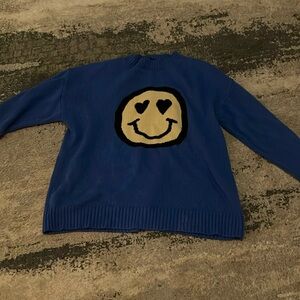 Blue smiley face sweater